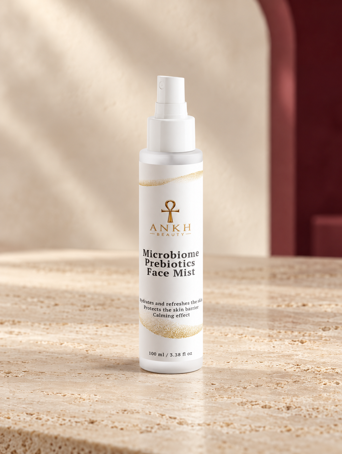 Microbiome Prebiotics Face Mist, original Ankh Beauty packaging on warm ivory stone