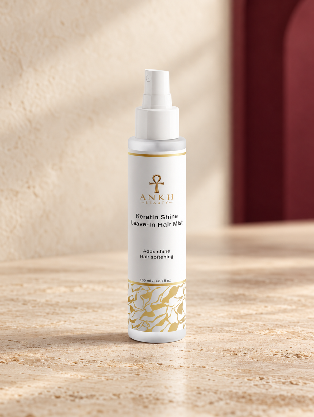 Keratin Shine Leave-In Hair Mist, original Ankh Beauty packaging on warm ivory stone