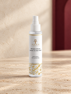 Keratin Shine Leave-In Hair Mist, original Ankh Beauty packaging on warm ivory stone