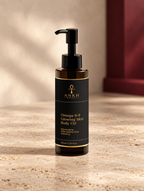 Omega 6-9 Glowing Skin Body Oil, original Ankh Beauty packaging on warm ivory stone
