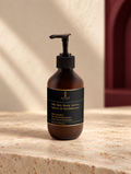 Silk Skin Body Serum, Spices & Sandalwood, original Ankh Beauty packaging on warm ivory stone