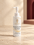 Blemish Purifying Face Wash, original Ankh Beauty packaging on warm ivory stone