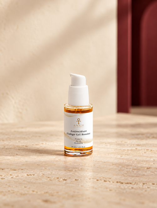 Antioxidant Ginkgo Gel Booster, original Ankh Beauty packaging on warm ivory stone