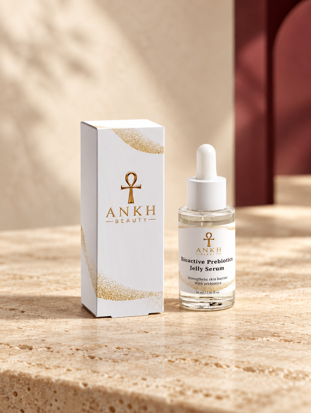 Bioactive Prebiotics Jelly Serum, original Ankh Beauty packaging on warm ivory stone
