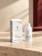 Brightening Eye Cream, original Ankh Beauty packaging on warm ivory stone